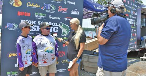 Lumpkin’s Cooper McDonald and Jake Barrett take time for interviews following one of their weigh ins at the High School Fishing National Championships. The tandem represented the LCHS Bass Fishing Team in the National and World Finals, earning a seventh place finish in both events.