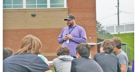 LCMS head coach Hayden Grizzle addresses his team after a recent summer workout. Having worked at both the middle school and high school level, Grizzle said he enjoys coaching the middle school age players the most because he feels he can have a larger positive impact in their lives.