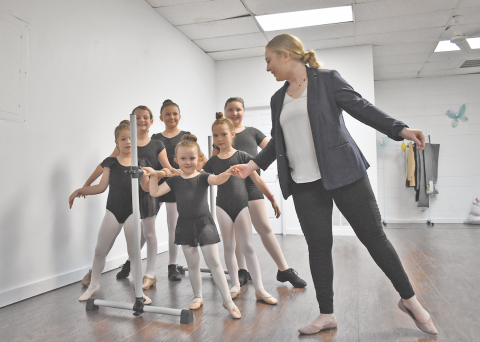Local ballet teacher Kelli Roberts and her students prepare for class