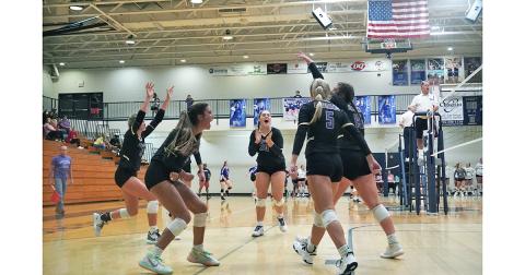 The LCHS Volleyball team celebrates after a massive point in its match versus White County on Thursday. Despite the disappointing start to the season, the team came through with the pressure on to claim its first win of the season against White County, remaining undefeated in region play to begin the year.