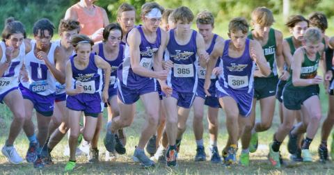 The LCHS Boys Cross Country team makes a dash at the start line during last week’s North Hall Invitational. Behind strong finishes from Ben Sherill and Wyatt Windham leading the way, the boys took first place at the event.