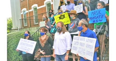 A group of University of North Georgia professors and faculty gathered for a quick rally in favor of a mask mandate being enforced indoors at UNG.