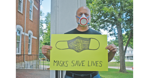 Art professor Jon Mehlferber, is wearing the mask he 3D printed hundreds of last spring. 