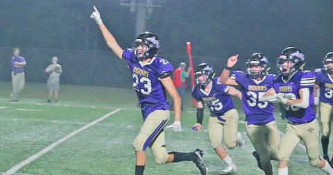 Preston Cox and his defensive teammates run off the field in celebration after Cox made the game-saving tackle on fourth down to give the Indians their second win of the season.