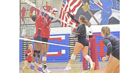 LCHS senior Reagan Spivey attempts to slam the ball past the front wall of Sandy Creek during Lumpkin’s first round state playoff match on Tuesday.