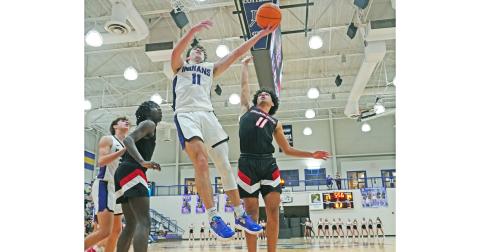 Senior Jones Harris goes up for a layup during a second half in which he scored 17 of his team-leading 20 points as Lumpkin faced off with Flowery Branch in its season opener.