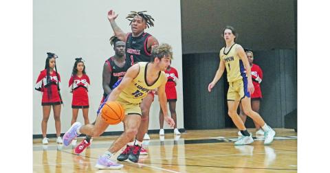 Lumpkin’s Jack Carroll looks to kick the ball back out to an open shooter during the Indians’ scrimmage on Thursday. Head coach Michael Parker said he expects big things from Carroll in the 2021-22 campaign.