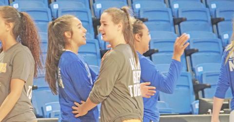 Former LCHS teammates Isabel Davenport (left) and Makenzie Caldwell share a brief moment following a face off between their new teams as Davenport’s UNG Nighthawks and Caldwell’s Emmanuel Lions bid each other ‘good game’ following their matchup.