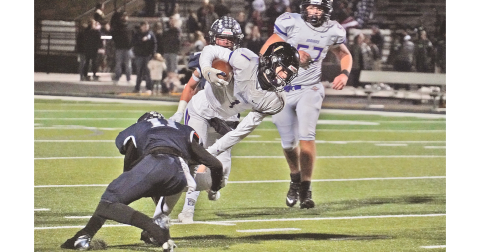 Lumpkin freshman Cal Faulkner lunges forward for extra yards as he’s tackled during the Indians’ final game of the season at West Hall.