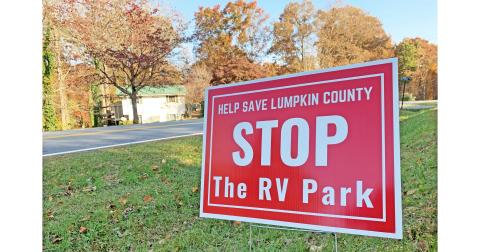 The bright red signs calling for a halt to the proposed RV park have become a familiar sight on the north end of the county.