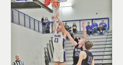 Preston Cox puts up a tough layup in the post versus Gilmer County on Tuesday, Dec. 14. Despite facing a talented and experienced team with tons of height and skill in the post, the Indians’ big man held his own, scoring 11 points and five rebounds in the game.