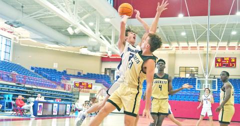 Preston Cox goes up for a tough shot in the post during the Indians’ game against TL Hanna during Day 3 of the Jackson EMC Tip Off Classic.