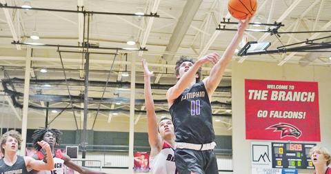 Senior Jones Harris goes up for a layup after successfully driving through the Falcon-filled post. Harris led the Indians with 28 points as the only Indian to score in double digits in the game.
