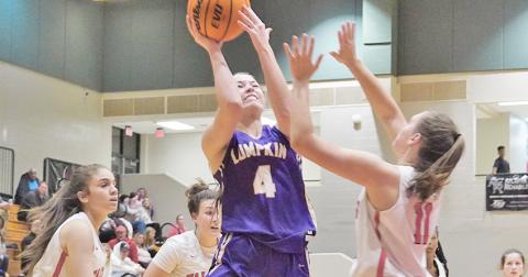 Sophomore Averie Jones puts up a tough shot while under pressure during the Indians 62-24 win. Jones had 16 points in the game to help lead the Indians.