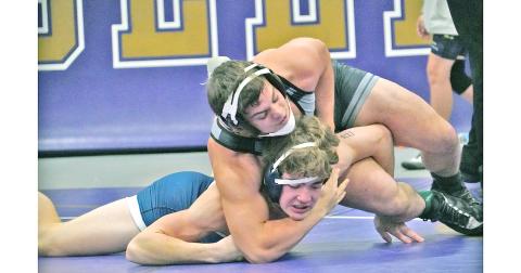 Senior wrestler Austin Evans locks down on his opponent during a match earlier this season. Evans is one of many that head coach Sean Hage is expecting to lead the Indians this season on the mats.