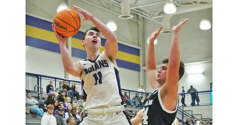 Lumpkin senior Jones Harris puts up a shot with eight seconds left in regulation against West Hall on Friday. Harris was fouled on the play, heading to the line where he converted both free throws to give the Indians a late two-point lead.