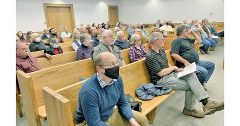 Before lining up at the podium, meeting attendees listened intently to the county commissioners discuss land use in Lumpkin.