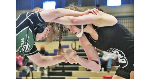 Senior Chloe Carver eyes her opponent before eventually pinning him to seal the win and third place finish in the region for the Indians. Carver made quick work of her opponent, getting the first round pin and earning the maximum amount of points for her team, which needed it to edge out the Trojans, 39-37.