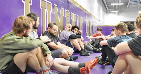Lumpkin head coach Sean Hage addresses wrestlers in the team’s final practice before the Murray County Invitational.