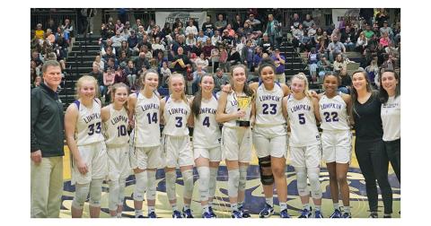 The Lumpkin County High School Girls Basketball team win the Region Championship trophy for the second-straight year.
