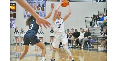 Ciera Brooks looks to feed the ball to an open teammate during Lumpkin’s win over White County.
