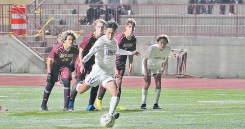 Nicholas Esqueda knocks in the equalizing penalty kick in the second half of Lumpkin’s match against Dawson on Friday night, tying the game at 2-2.