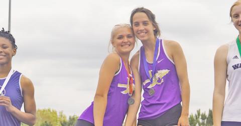 Lumpkin leapers Kaylee Caldwell (left) and Mercades Housman pose atop the podium after securing first and second place in the triple jump event at the region championship competition. Housman took first in both triple jump and long jump with Caldwell a close second in both events.