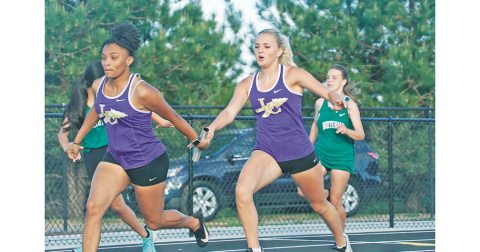Returning state finalists in the girls 4x100, Kaylee Caldwell (right) hands off to Aniya Persaud smoothly. The runners finished second in the relay, inching to within a second of Cherokee Bluff, who has just edged them out all season long.