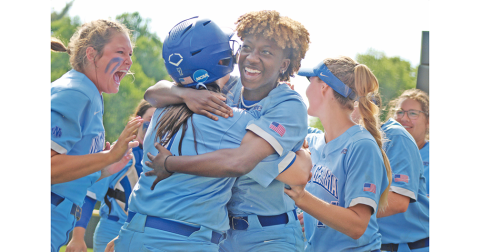 After being held in check for most of the day, the Nighthawks exploded, first on the field, then in celebration as Mariah Wicker (right) hugs teammate Madison Simmons after her teammate scored from first to give UNG its first lead of the day in extra innings of the season-determining game. Now the squad is headed to Denver for the NCAA Division II National Championship.