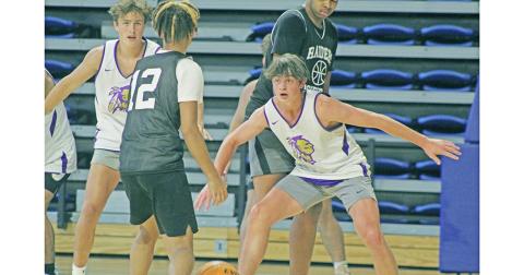 LCHS Boys Basketball players Jac Chambers (right) and Walker Scott focus in to try and make a play on the defensive end during UNG’s Team Camp last week.