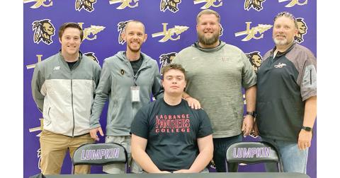 Graduating senior Cameron Simpson signed to play college football at Lagrange College earlier this year. Pictured with Simpson at the ceremony are coaches (from left): Andrew Hinchliffe, Caleb Sorrells, John Dye and Steve Horton.