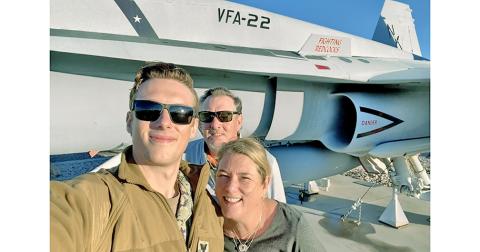 Petty Officer 1st Class Chandler Alexander feels the need, the need to lead in the TOPGUN training program. The Lumpkin County High School alum is pictured alongside his proud parents Steve and Casey Alexander.