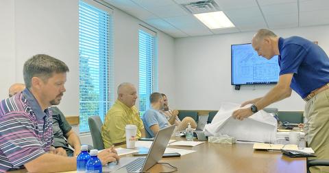 Lumpkin County Commissioners discuss the latest blueprint for the proposed county pool at last week’s BOC meeting.