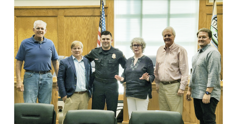 Officer Chris Weeks, third from left, was honored alongside, from left, Ross Shirley, Johnny Ariemma, Mayor JoAnne Taylor, Ron Larson and Ryan Reagin.