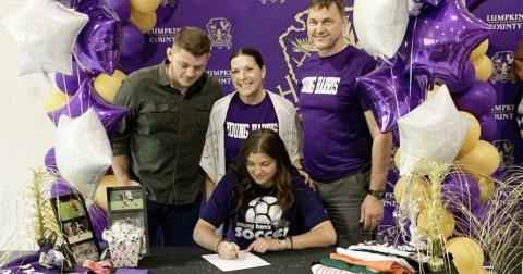 Lumpkin soccer star Reagan Spivey signs with Young Harris College to play soccer in a signing ceremony with her family.