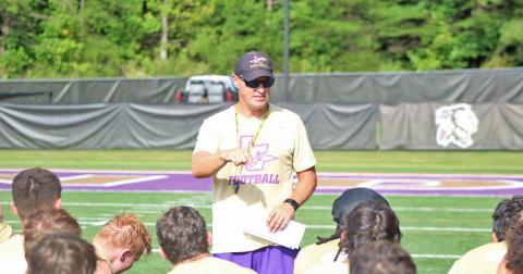 New Lumpkin County High School football head coach Heath Webb speaks to his team after a practice last week.