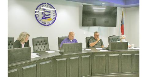 Board of Education members (from left) Lynn Sylvester, Superintendent Rob Brown, Jim McClure and Mera Turner defended the school system's position on the proposed budget at a recent public hearing.