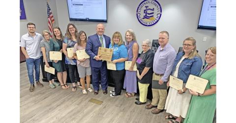 Lumpkin County School Superintendent Rob Brown and the members of the Board of Education recently honored the hard-working volunteers of the Well Read, Well Fed program including, from left, Chandler Girton, Shirley Christman, Samantha Fuerstenberg, Karen Shepherd, Debi Holloway, Brown, CHP Director Melissa Line, Lynn Sylvester, Mera Turner, James Forester, Tristen Parrish and Jennifer Moss.