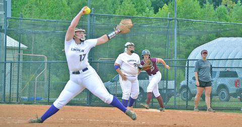 Lumpkin’s Natalie Shubert tosses a pitch with a Dawson runner on first base last week. The Tigers narrowly defeated the Lady Indians 2-0.
