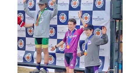 Lumpkin County eighth grader Mathieu Weber (center) finished third at the team’s recent race.