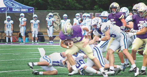 LCHS junior fullback Mason Sullens powers ahead against the Oconee County defense in the Indians Class AAA playoff game on Saturday.