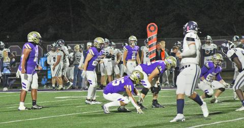 The Lumpkin County defense lines up against West Hall. The Indians earned a 48-7 victory at home in the regular season finale.