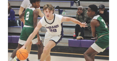 Lumpkin sophomore TJ Gaddis advances the ball toward the basket in the Indians’ victory over Cross Keys.