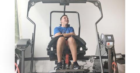 Jon Crais works his core muscles with an AllCore 360 machine. Crais has battled his way back after a traumatic car crash nearly a decade ago.