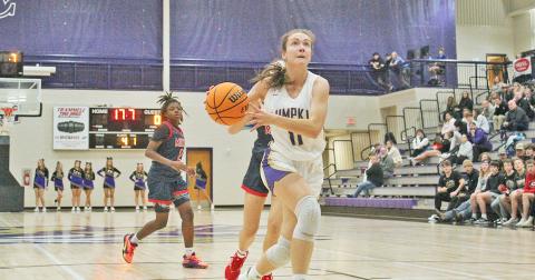 Lumpkin County’s Mary Mullinax looks for an opening to the basket against the Milton defense. Mullinax and teammate Averie Jones were voted MVPs of last week’s tournament.