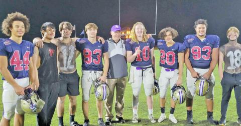 Players representing Lumpkin County in the FCA East vs. West All-Star Classic were (from left) Cam Stringer, Mason Sullens, Caleb Norrell, head coach Heath Webb, Cooper Scott, Tavion Lawrence and Jay Grizzle alongside members of the LCHS Crunk Crew.