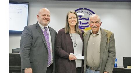 Claude Gilstrap (right) presented donations totaling $8,000 to Lumpkin County Schools Superintendent Dr. Rob Brown and Lead School Social Worker Joni McElwaney at the Board of Education’s November session.