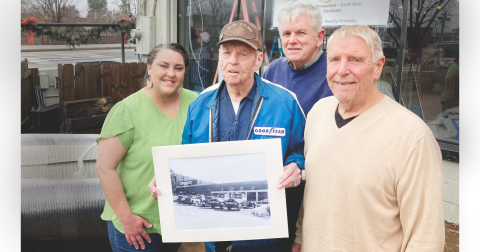 Pictured (from left) operations manager Mea Inglehart, Henry Moore, Jr. (holding a photo of the property from the 1950s), Rick Harris, and owner Art Attaway, took a break during final preparations for the new restaurant last month.