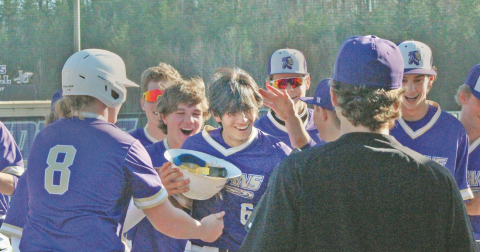 The Lumpkin County varsity baseball team celebrates Alejandro Narvaez’s home run against Towns County.