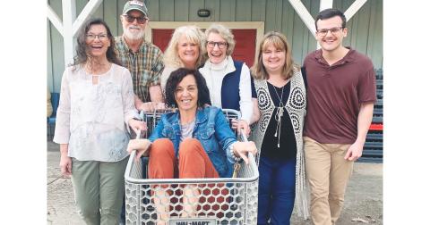 CHP staff members, from left, Debi Holloway, Lee Tidwell, Erin Cook, Barbara Day Miller, Melissa Line, Chandler Girton and Paula Payne (in the cart) are ready for a fun fundraiser. (Photo by Matt Aiken)